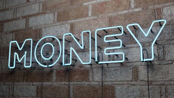Money sign on a wall in an office of a divorce solicitor for financial disclosure in divorce proceedings.